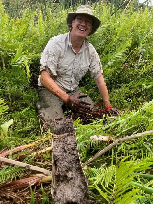 Professor David Sear with mud extracted from swampland in French Polynesia
