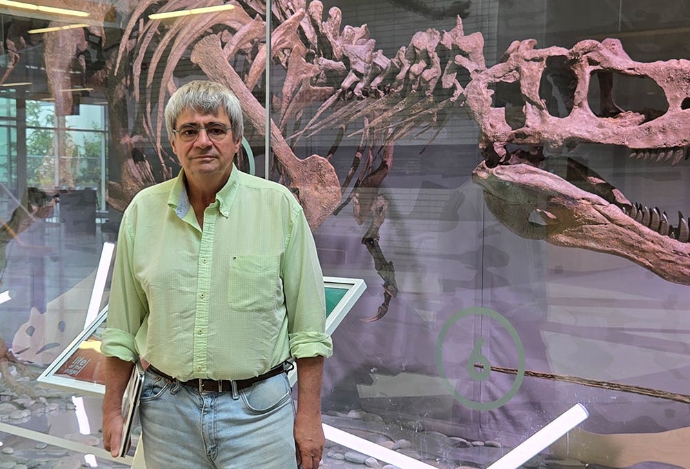 Dr. Philippe Claeys, a visiting professor at the University of British Columbia, in front of an exhibit at the Pacific Museum of Earth.