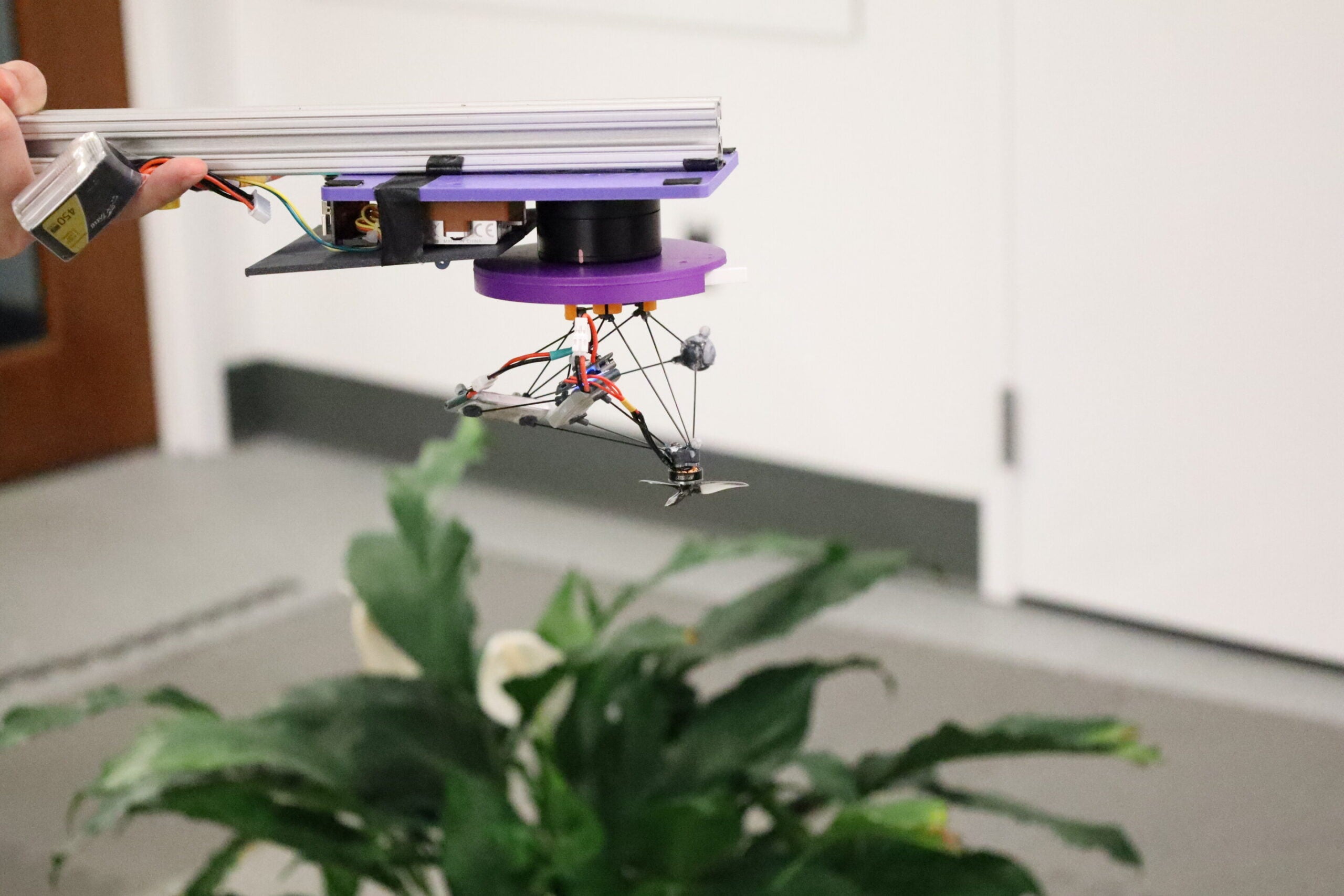 Components are spread around the drone — at different heights and different angles with lots of space in between — to prevent them from visually overlapping when spinning. So, when everything blurs together, the drone becomes a faint, semi-transparent cloud rather than a distinct shape.