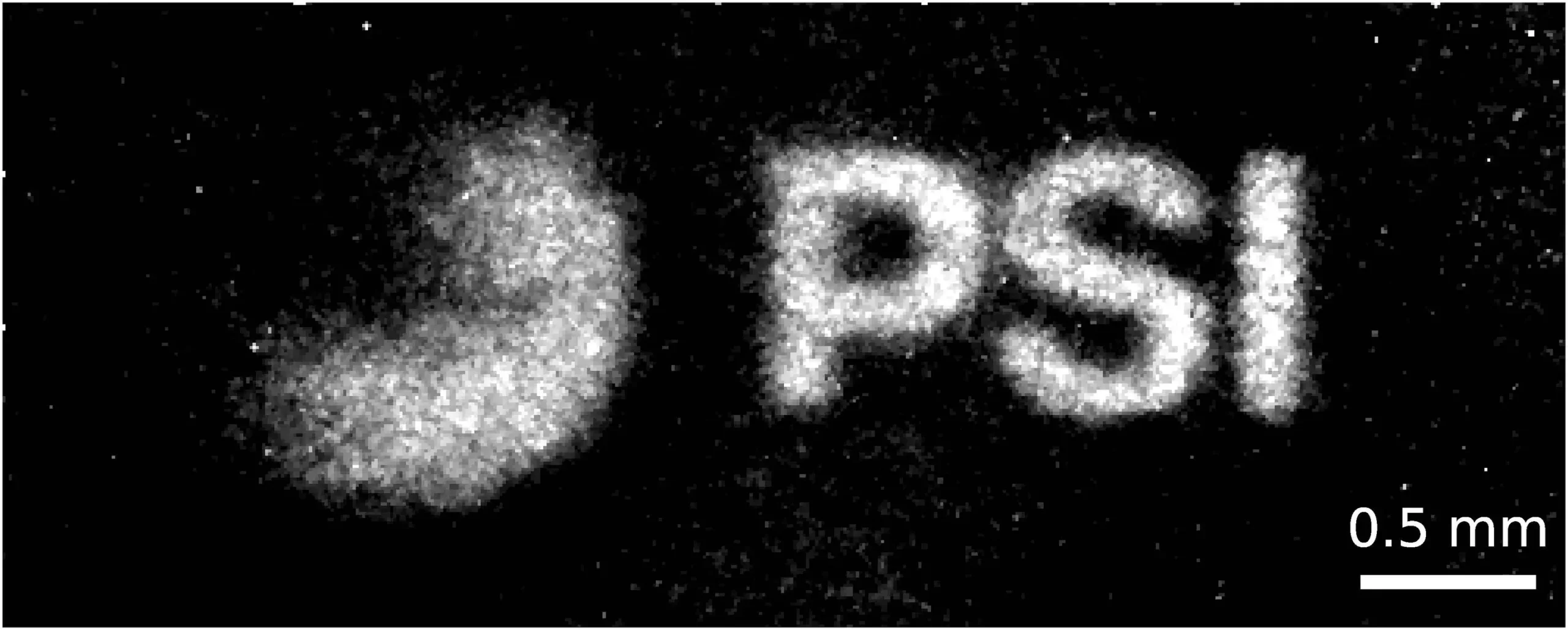 A sharper view from metres away: This magnified neutron image of a three millimeter PSI logo was acquired using the new achromatic neutron lens, with the logo placed six metres from the detector. Without the lens, comparable resolution would require the object to be placed within centimetres – or even millimetres – of the detector. 