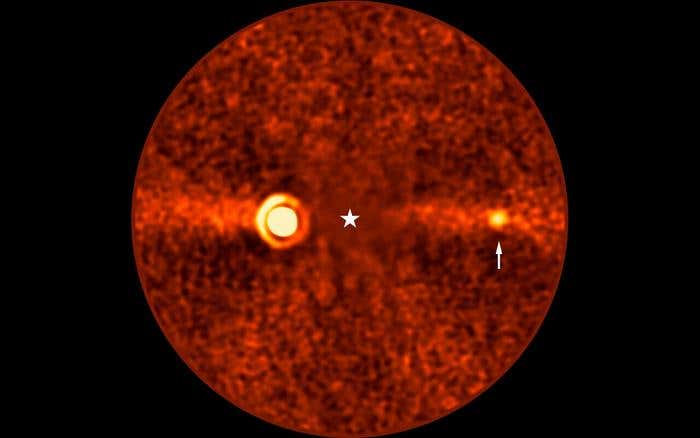 A faint giant planet hid near Beta Pictoris b for over a decade before astronomers recognized it in archived images.