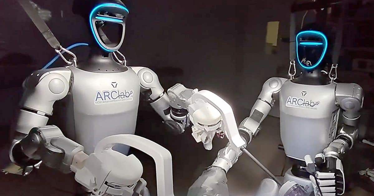 Two teleoperated robots work as a team to perform a laparoscopic gallbladder removal during a pre-clinical trial.