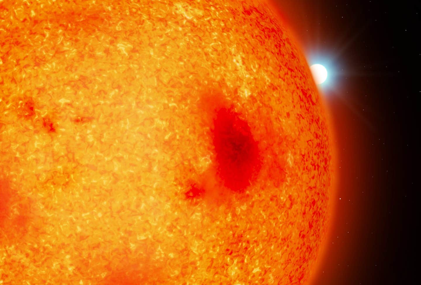 An artist impression of a red dwarf with a white dwarf binary companion peeking out from behind. The diameters of the two stars are shown to scale