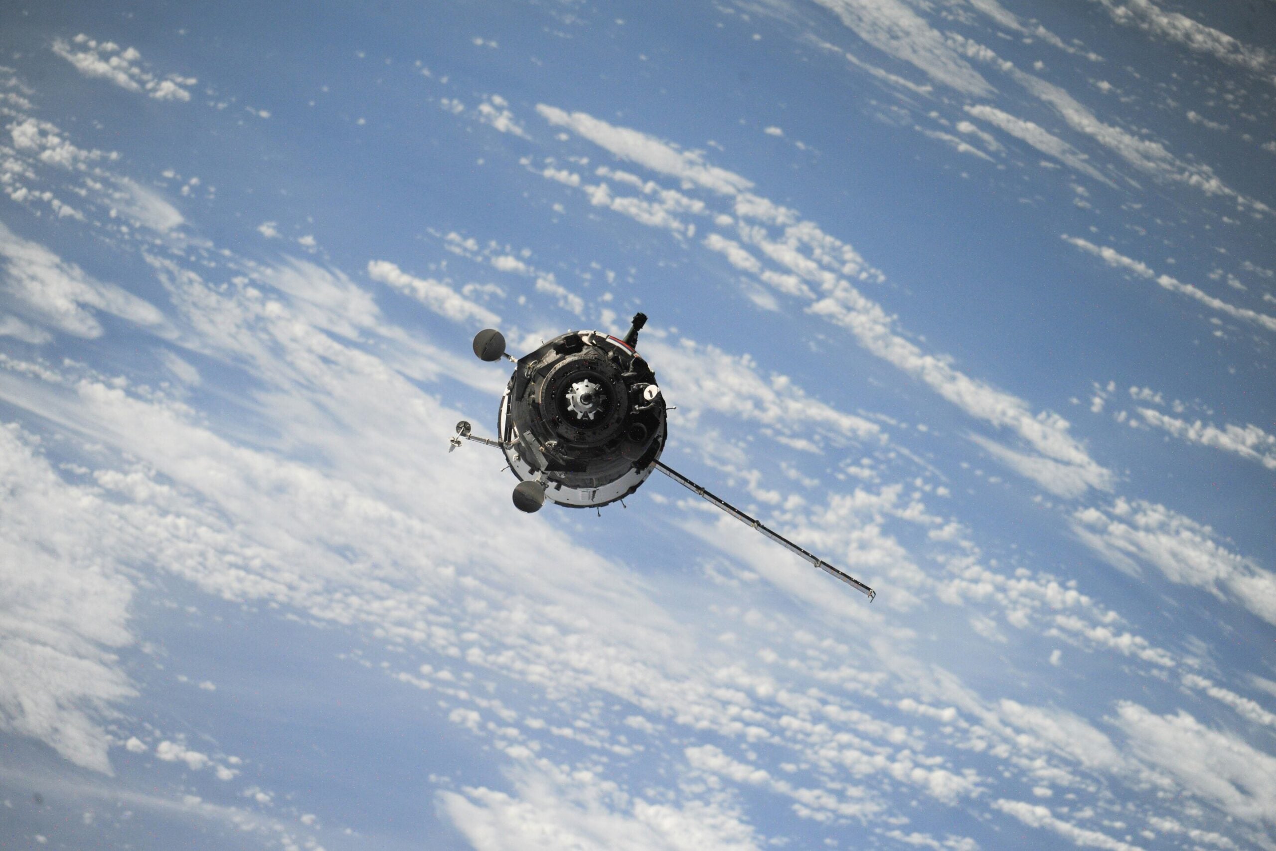 Spatial structure and temporal change become entangled because a spacecraft moves while particles drift around the planet.