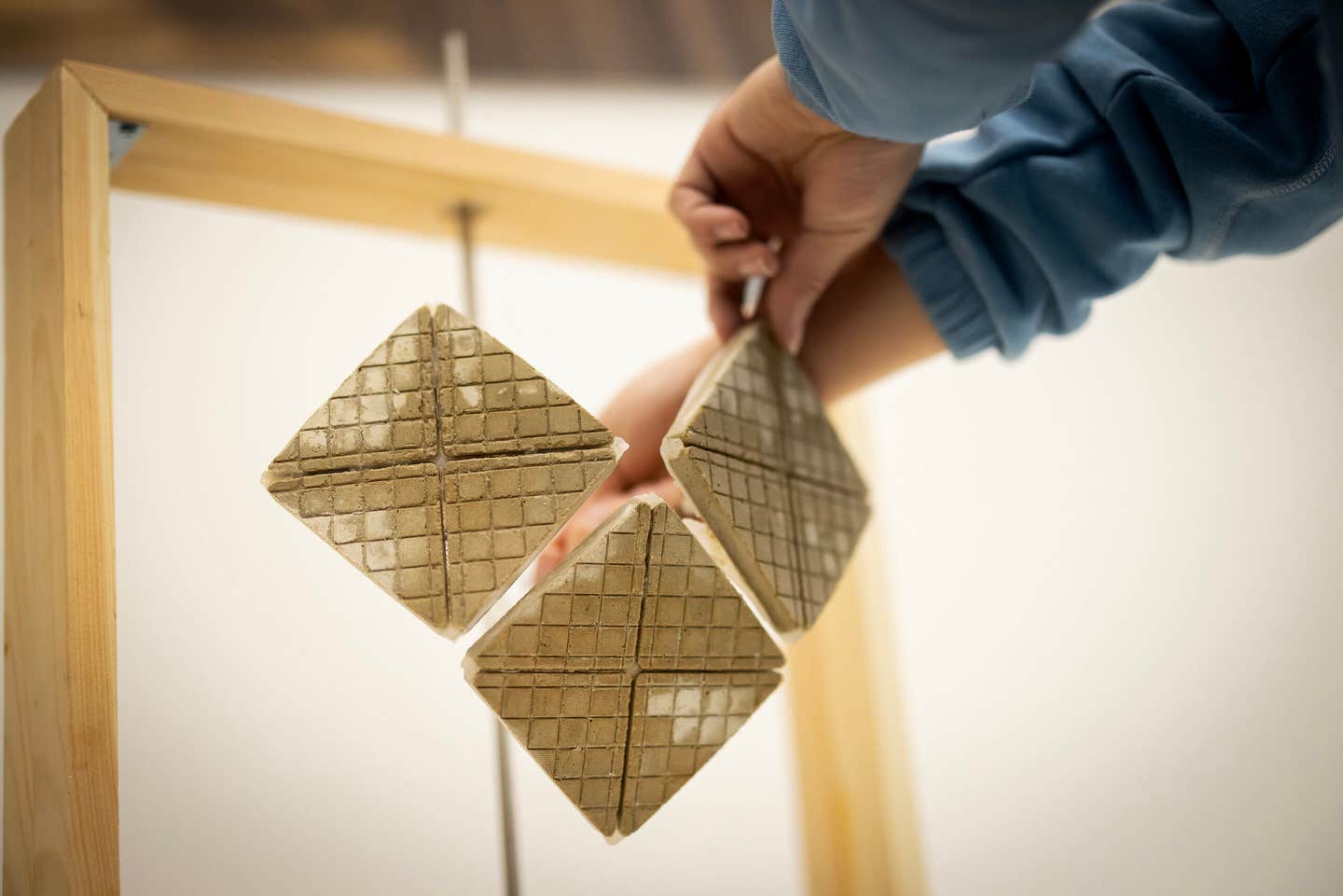 Inspired by the cracked, water-retaining skin of African elephants, architect Dorit Aviv and materials scientist Shu Yang have designed a cement-based tile that captures and slowly evaporates water, lowering surface temperatures without air conditioning.