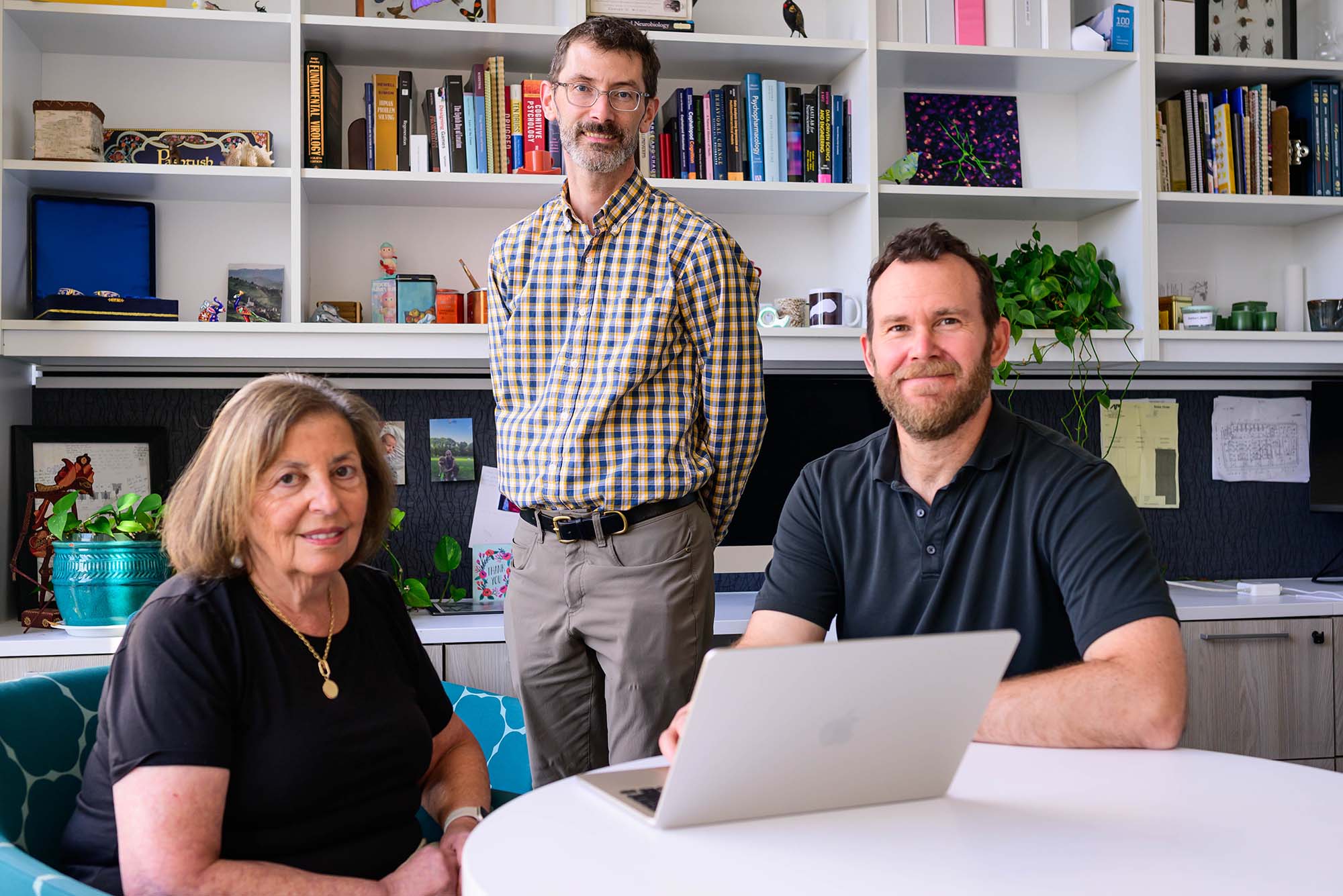 BU researchers (from left) Helen Tager-Flusberg, Joseph McGuire, and Benjamin Scott used the video game to pinpoint a potential cause—a phenomenon called “noisy evidence integration”—of some perceptual impairments in people with autism.
