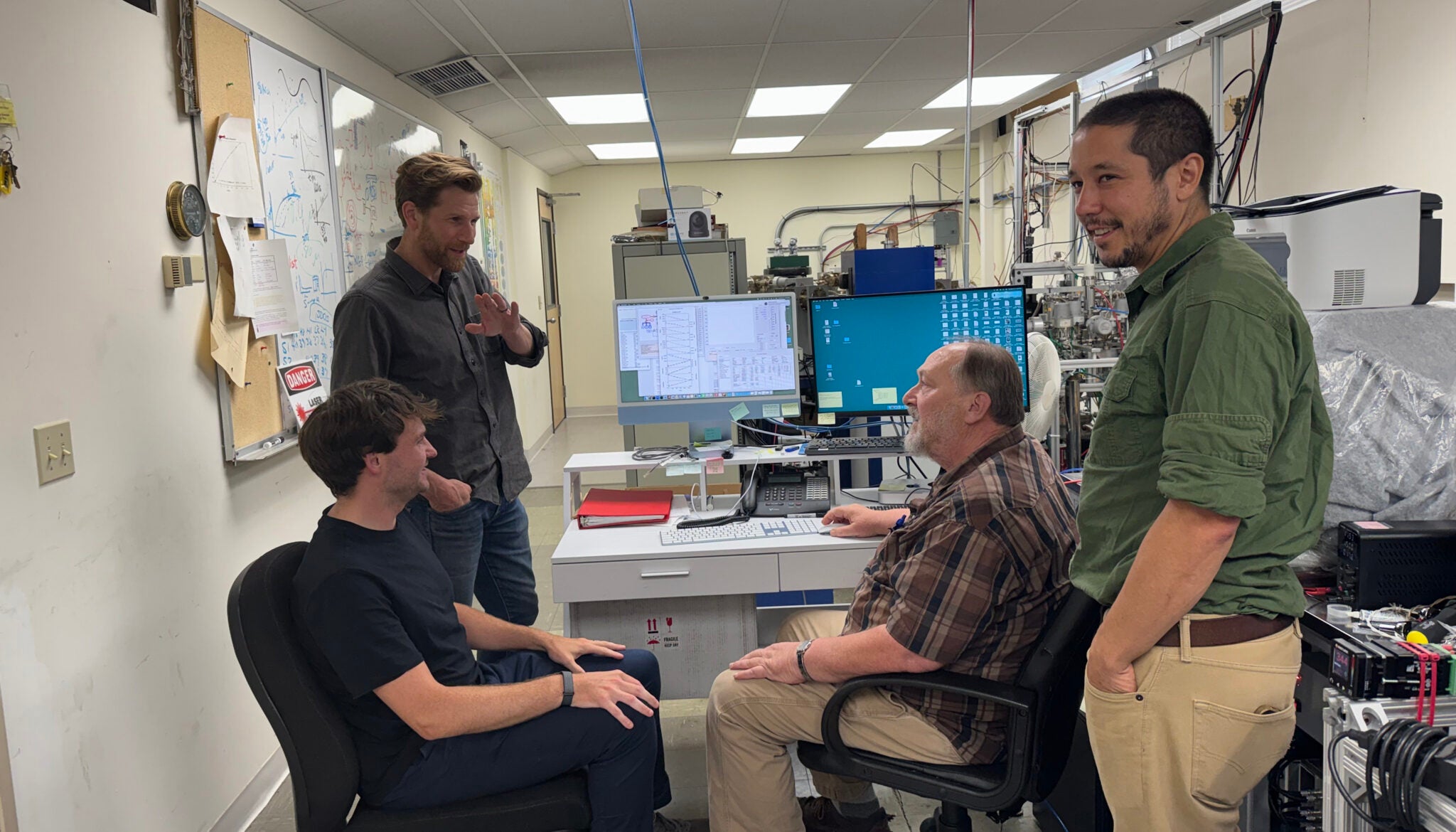 Bill Cassata, Jack Carter, Paul Renne, and Andy Tholt in the mass spectrometry lab at the Berkeley Geochronology Center.