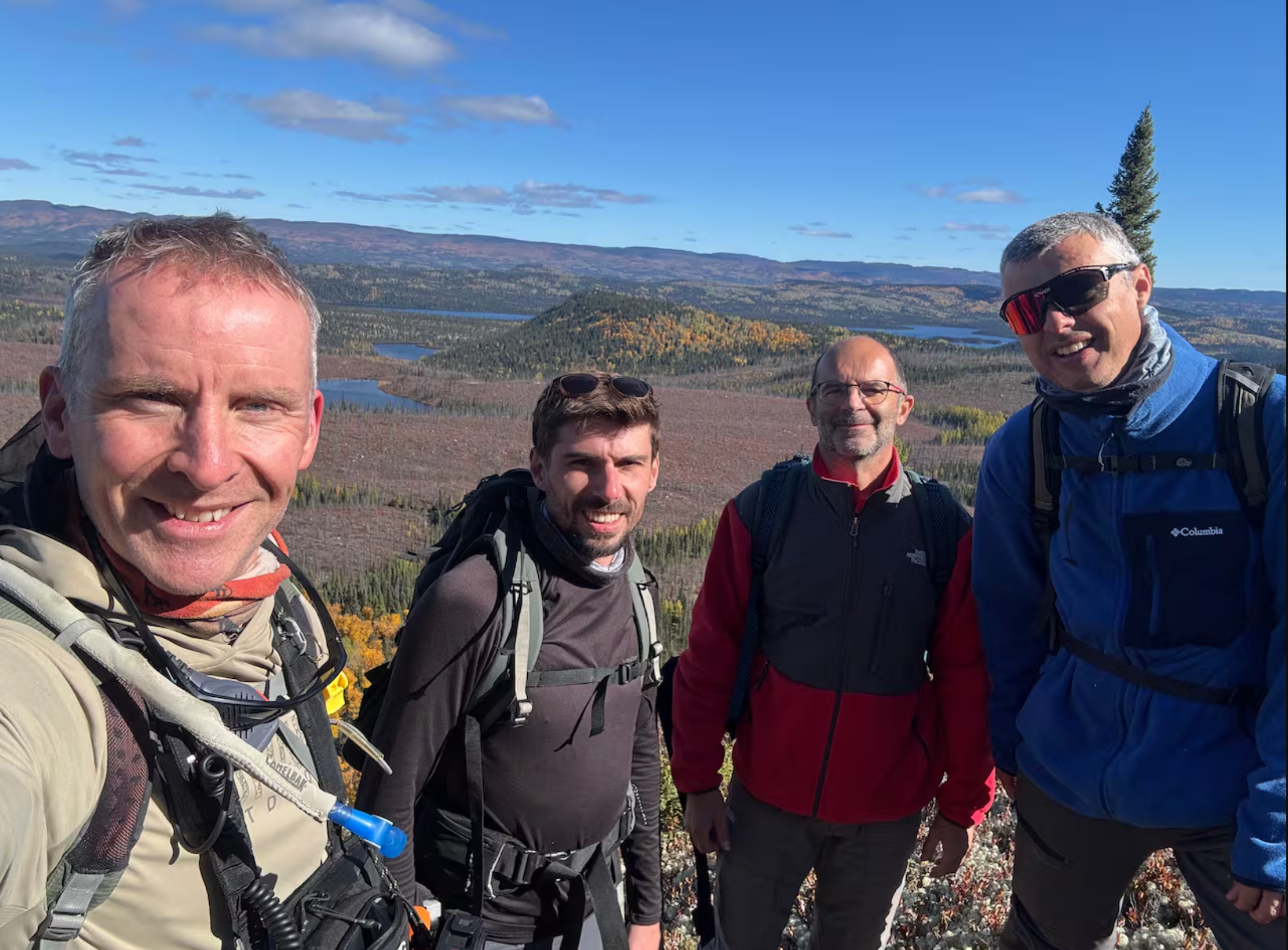 Gordon Osinski, left, with researchers Anthony Lagain, Jérôme Gattacceca and Yoann Quesnel at the Quebec crater site in 2025.
