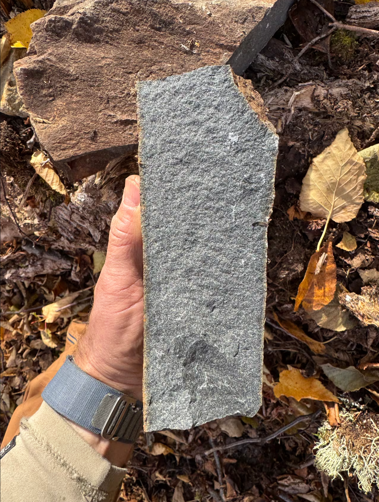 Gordon Osinski holds impact melt rock, formed by the intense heat and pressure of a meteorite impact.