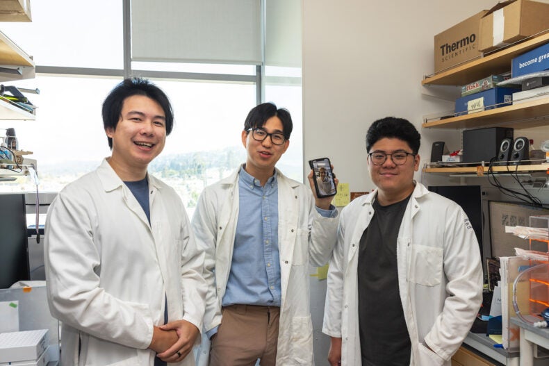 Terry Zhang, Peter Yoon, Kenneth Loi (left to right) wanted to make sure to include Trevor Docter (on the phone from Harvard).