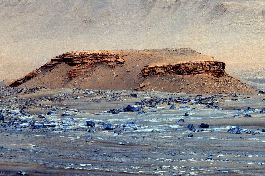 Perseverance found Jezero rocks altered by at least three water systems involving carbonates, silica and later hydrothermal fluids. This Mastcam-Z-enhanced color photo mosaic shows a butte near Jezero crater.
