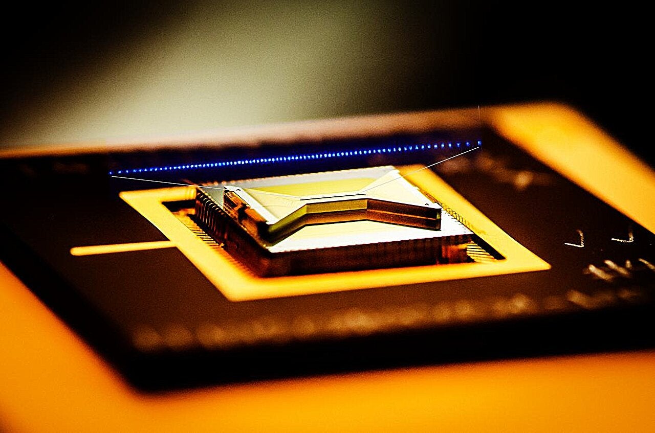 A closeup view of a surface ion trap, the type of quantum computing technology used in this study.