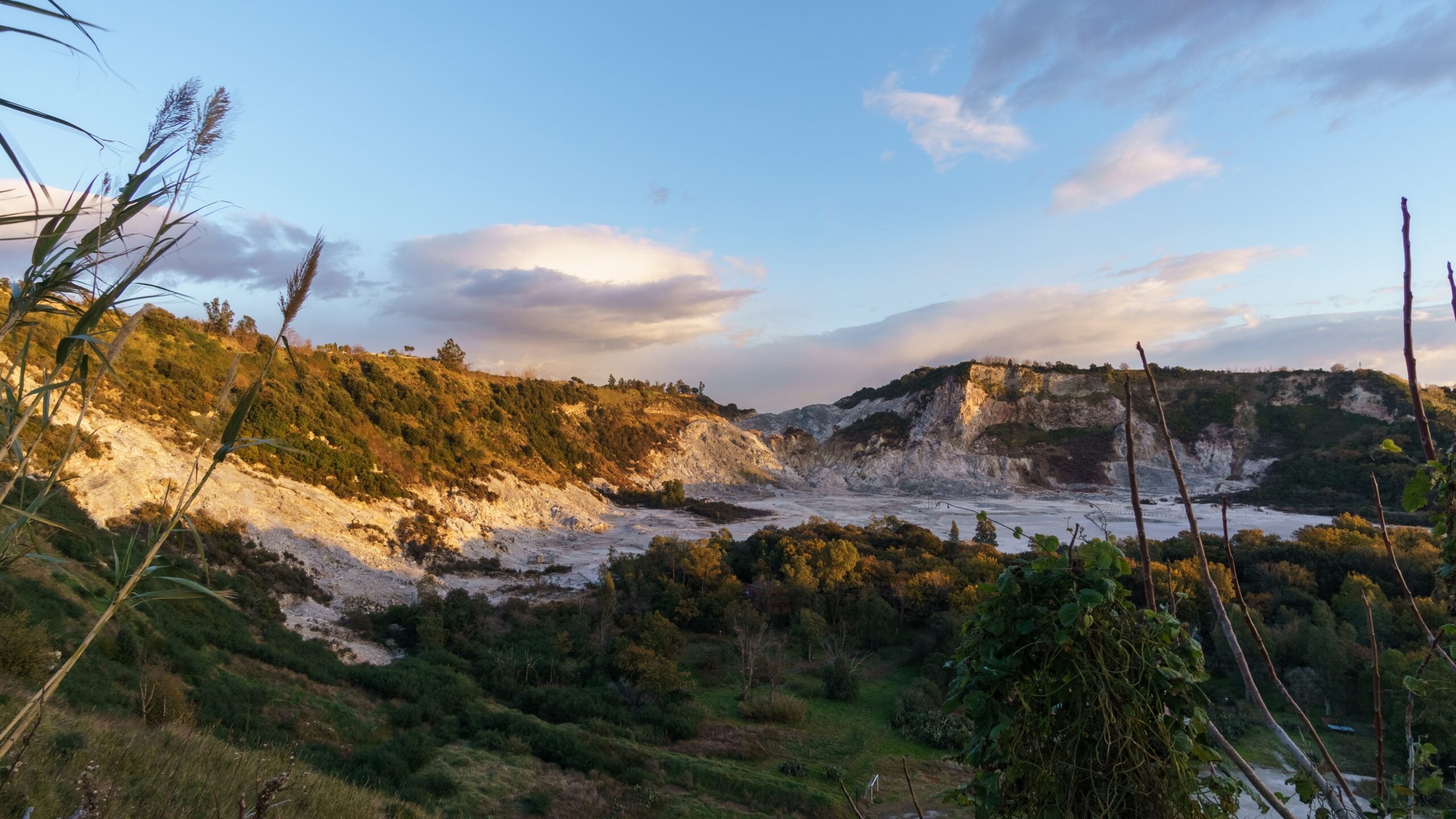 Solfatara of Pozzuoli at Campi Flegrei near Naples during golden hour on evening sunset, Pozzuoli, Campania, Italy