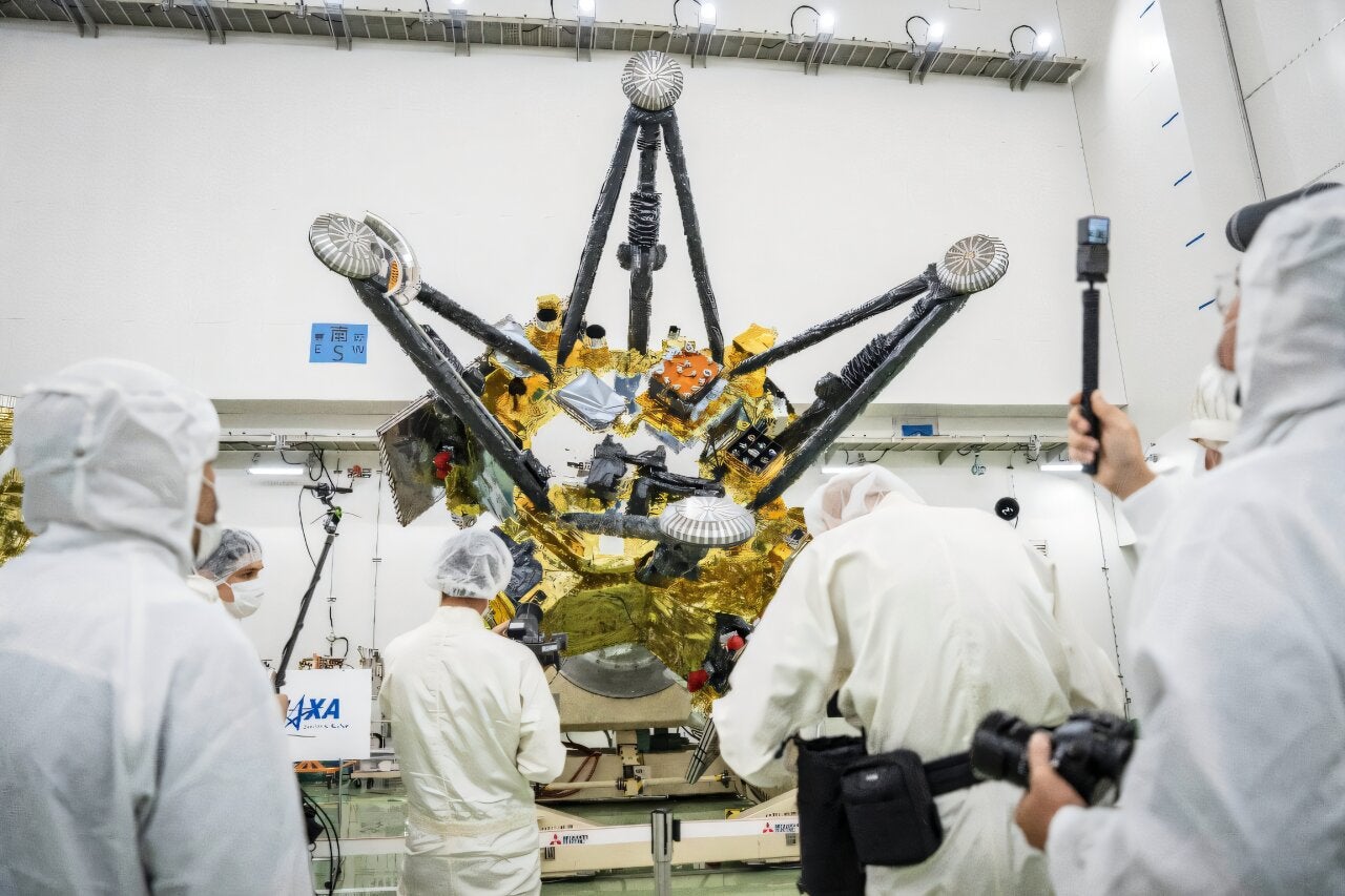 Media crews film Japan’s Martian Moons eXploration (MMX) spacecraft modules at Tanegashima Space Center on August 13, 2026.