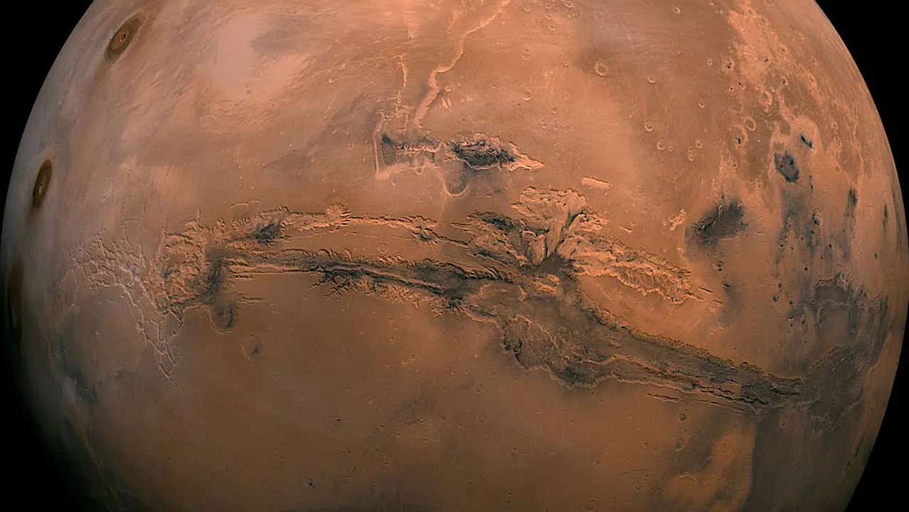Orbital evidence points to an eroded volcano near Mars’ equator, where buried glacier ice may survive beneath volcanic deposits.