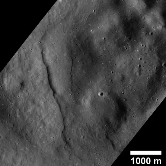 Lobate scarps in a permanently shadowed region within the Mouchez L impact crater near the moon’s north pole. Lunar lobate scarps are young, cliff-like landforms created by thrust faults, which form when crustal material contracts and breaks with one side pushed up and over the other.