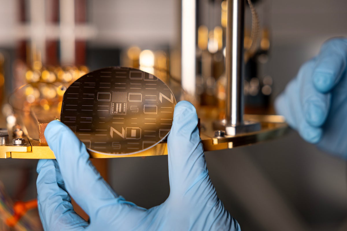 A wafer with many different designs of chips for the TESSERACT project.