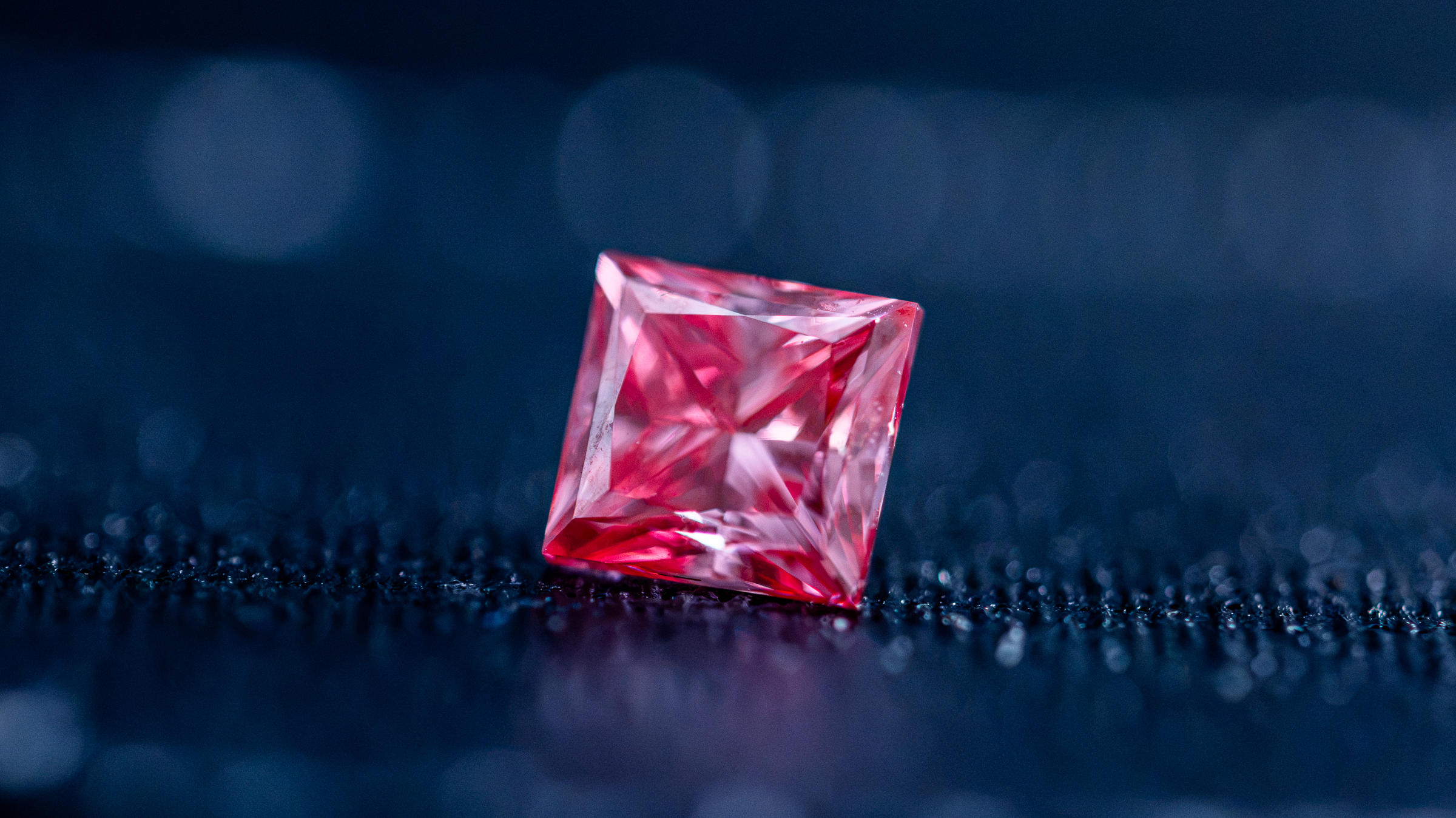 Pink diamonds containing specially placed nitrogen atoms show promise for quantum computers and advanced sensors. These unique atomic structures give diamonds properties that could help power future quantum technologies.
