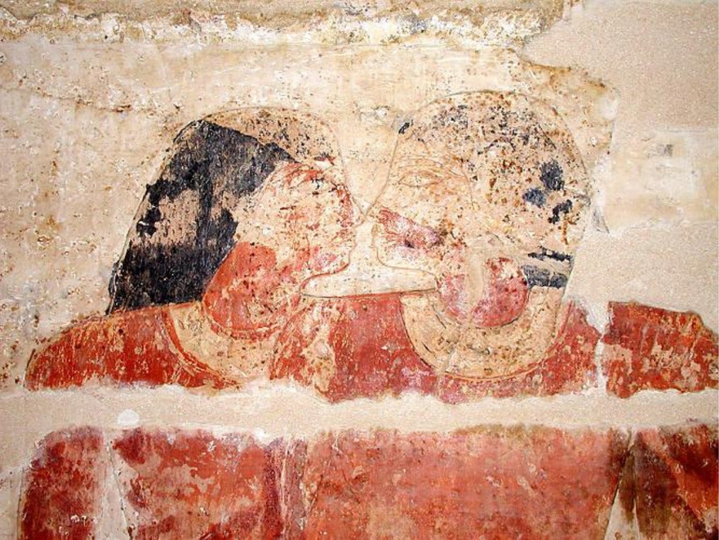 Depiction from an Egyptian tomb of two courtiers standing nose-to-nose from their tomb in Saqqara in Egypt. 