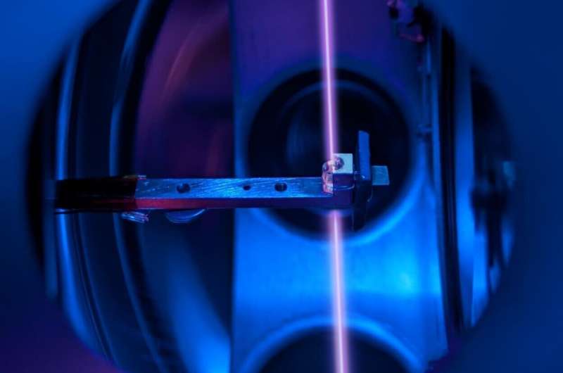 The thorium crystal and the laser beam